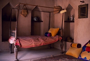 Crenellated Prints: A four-poster bed in a girls bedroom in Nakhl