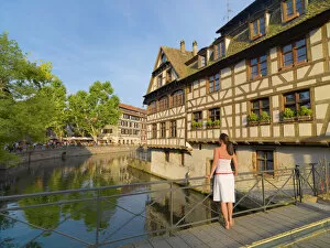 Alsace Gallery: France, Alsace, Strasbourg, La-Petie-France, Woman looking at view (MR)