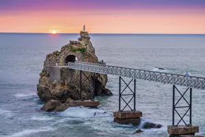 Biscay Prints: France, Aquitaine, Pyrenees Atlantiques, Biarritz. Rocher de la Vierge at sunset