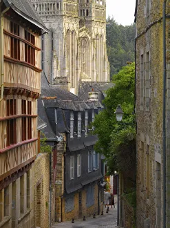Quimper Prints: France, Brittany, Finistere, Quimper, view down cobbled street to Saint Corentin cathedral