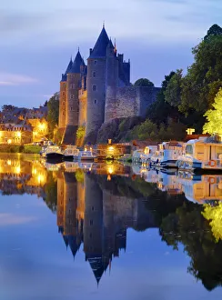 France, Brittany, Morbihan, Josselin, Chateau de Rohan castle on the Oust River at night