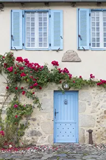 Limousin Prints: France, Correze, Argentat, A colourful facade of an old stone house with blue shutters