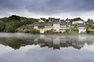Limousin Prints: France, Correze, Argentat, Old houses and a layer of mist are reflected in the Dordogne