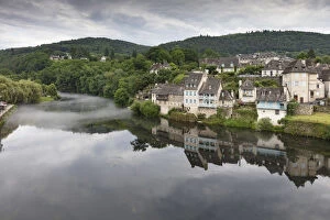 Images Dated 27th June 2017: France, Correze, Argentat, The old town reflected in the Dordogne river with some