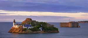France, Finistere, Bay of Morlaix, Carantec, Louet island and lighthouse with chateau
