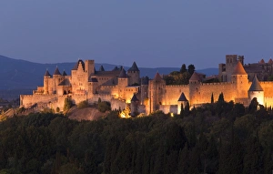 Cathars Prints: France, Languedoc-Rousillon, Carcassonne. The fortifications of Carcassonne at dusk
