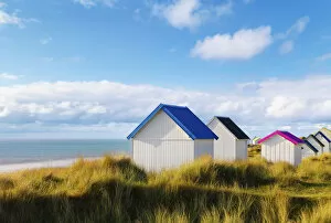 France, Normandy, Gouville Sur Mer, colourful beach huts