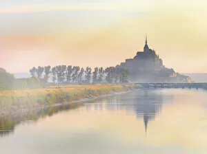 Cathedrals Gallery: France, Normandy, Le Mont Saint Michel, shrouded in fog at dawn, reflected in river