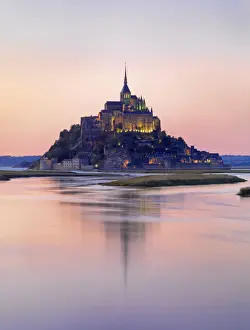 France, Normandy, Le Mont Saint Michel reflected in river at night