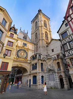 France, Normandy, Rouen, Le Gros Horloge, Woman photographing clock (MR)