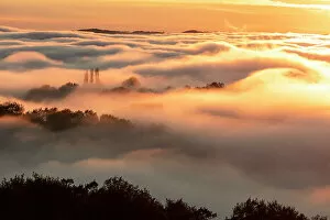 Images Dated 7th February 2023: France, Nouvelle-Aquitaine, Correze, landscape at the edge of the fog at sunset