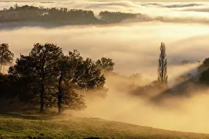 Images Dated 7th February 2023: France, Nouvelle-Aquitaine, Correze, landscape at the edge of the fog at sunset