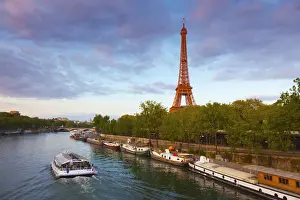 France, Paris, Eiffel Tower and tourist boat on River Seine