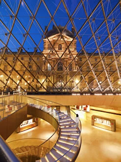 France, Paris, The Louvre, interior of museum illuminated at night(