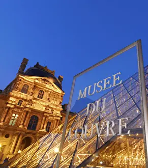 Ile De France Prints: France, Paris, The Louvre, museum, pyramid and sign illuminated at night