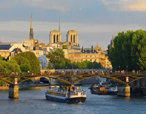 Images Dated 30th September 2013: France, Paris, Notre Dame Cathedral, tour boat on river Seine