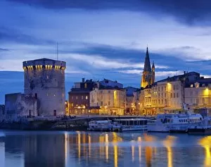 Images Dated 30th July 2012: France, poitou-Charentes, La Rochelle, town reflected in harbour at dusk