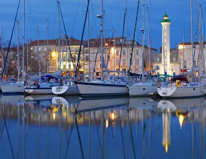 France, poitou-Charentes, La Rochelle, town reflected in harbour at night