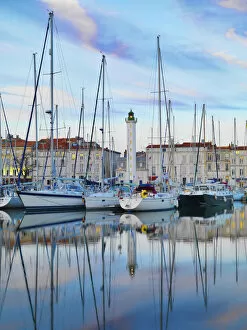 Poitou Charentes Gallery: France, poitou-Charentes, La Rochelle, town reflected in harbour at dusk