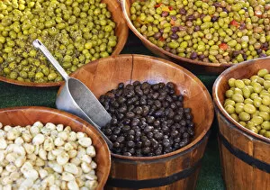 Images Dated 24th October 2019: France, Provence, Alpes Cote d Azur, Castellane, olives in drums at market stall