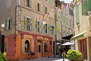 Images Dated 28th July 2023: France, Provence-Alpes-Cote d'Azur, Sisteron, a colourful street and shop fronts in Sisteron town