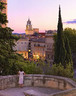 Vertical Prints: France, Provence, Avignon, Woman looking towards Town hall MR