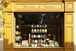Arles Prints: France, Provence, Bouches-du-Rhone, Arles, front of a brightly coloured facade of a shop