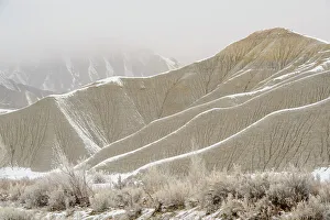 Eroded Prints: Fresh snow on eroded buttes, Caineville, Utah, USA