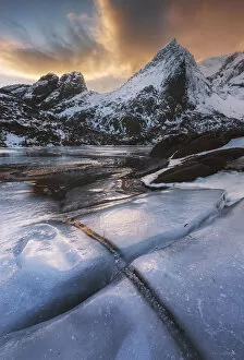 Images Dated 13th July 2020: Frozen lake near Nusfjord at sunset, Lofoten islands, Norway