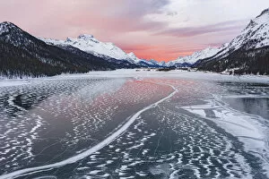 Images Dated 24th March 2021: Frozen Lake Silvaplana at sunrise during the cold winter, Maloja, Engadine