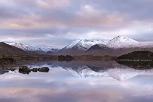Frozen Lochan na h-Achlaise and snow covered Black Mount mountain range, Rannoch Moor, Scotland
