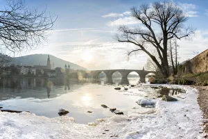 Frozen Neckar river and Old Bridge in Heidelberg, Baden-Wurttemberg, Germany