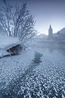 Sunrises Prints: The frozen river Inn framed by mist and snow at dawn Sils Canton of Graubunden Engadine