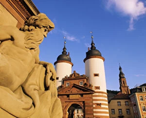 Images Dated 24th November 2011: Germany, Bavaria, Heidelberg, Statue on bridge and Heidelberg gate