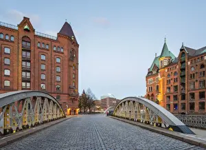 Germany, Hamburg, HafenCity. Historic warehouses in the Speicherstadt quarter at dusk