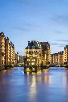 Hamburg Gallery: Germany, Hamburg, Speicherstadt. Historic Wasserschloss at dusk, view from the