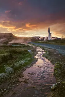 Geysir Prints: Geysir, Iceland. Iconic geyser steam jet erupting from the ground