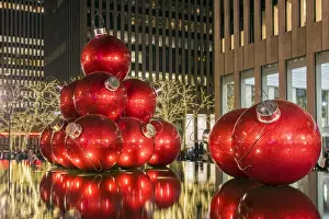 Giant red Christmas ornaments on display on Avenue of Americas (6th Avenue) during