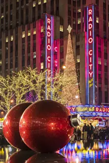 Giant red Christmas ornaments on display on Avenue of Americas (6th Avenue) during