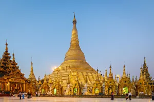 Stupas Prints: Gilded Shwedagon Pagoda against clear sky at dawn, Yangon, Yangon Region, Myanmar