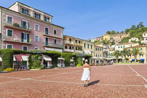 Girls Prints: A Girl is walking in the square of Porto Azzurro (Elba Island, Livorno, Tuscany