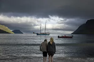 Images Dated 15th November 2022: Two girls at G! Festival in Syðrugota walking into the ocean