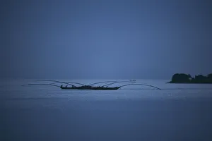 Rwanda Gallery: Gisenyi, Rwanda. Night fishermen head out onto lake Kivu with specially adapted boats