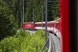 Glacier Express train climbing towards Zermatt, Valais, Switzerland