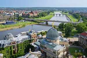 Saxony Prints: Glass dome of the Academy of Arts with golden Fama near Carola Bridge over Elbe River