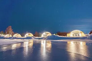 Absence Gallery: Glass igloo on the snowy shores of the frozen river Kalix, Ice and Light village, Kalix