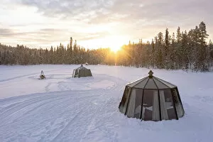 Images Dated 31st October 2022: Glass igloo for tourists in the frozen landscape at dawn, aerial view, Jokkmokk, Lapland, Sweden