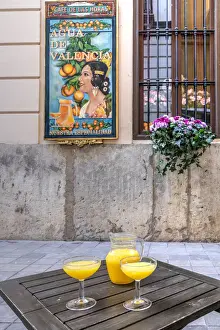 Glasses of Aigua de Valencia cocktail served in an outdoor bar of Valencia, Comunidad