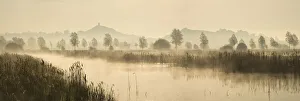 Glastonbury Tor across the Somerset Levels at dawn, Somerset, England