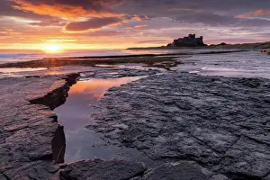 Northumberland Prints: Glorious sunrise above Bamburgh Castle on the Northumberland coast